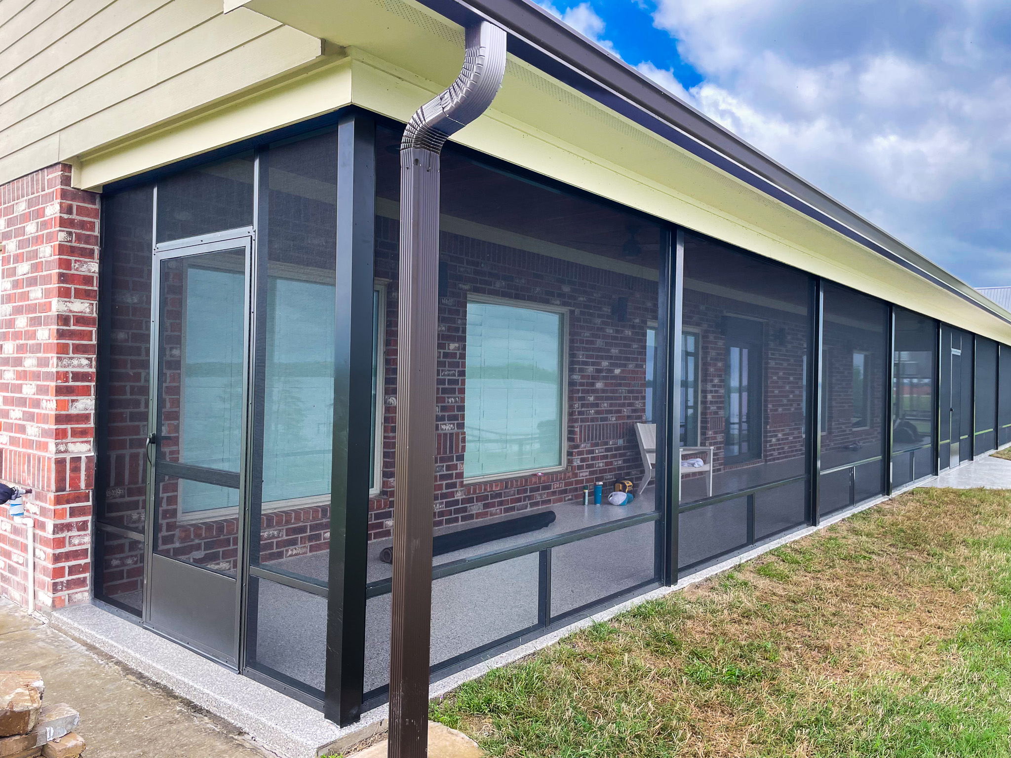 Custom aluminum screen enclosure installed on a brick patio in Mississippi</p>
<p>