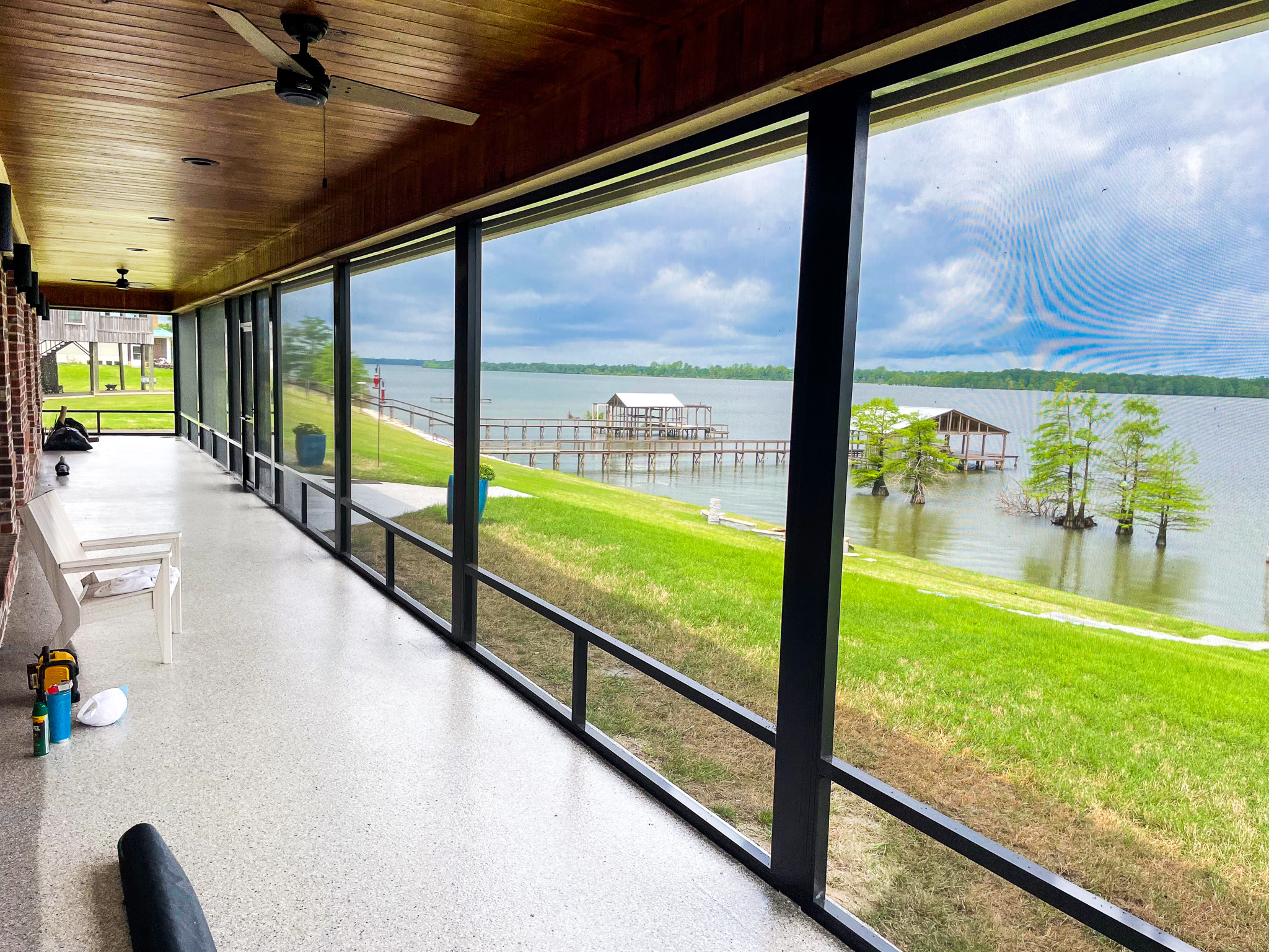 Scenic lake view from inside a screened-in porch with bug protection</p>
<p>